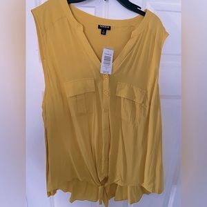 Yellow blouse fromTorrid. Size 1. Slightly high low with tie in front.